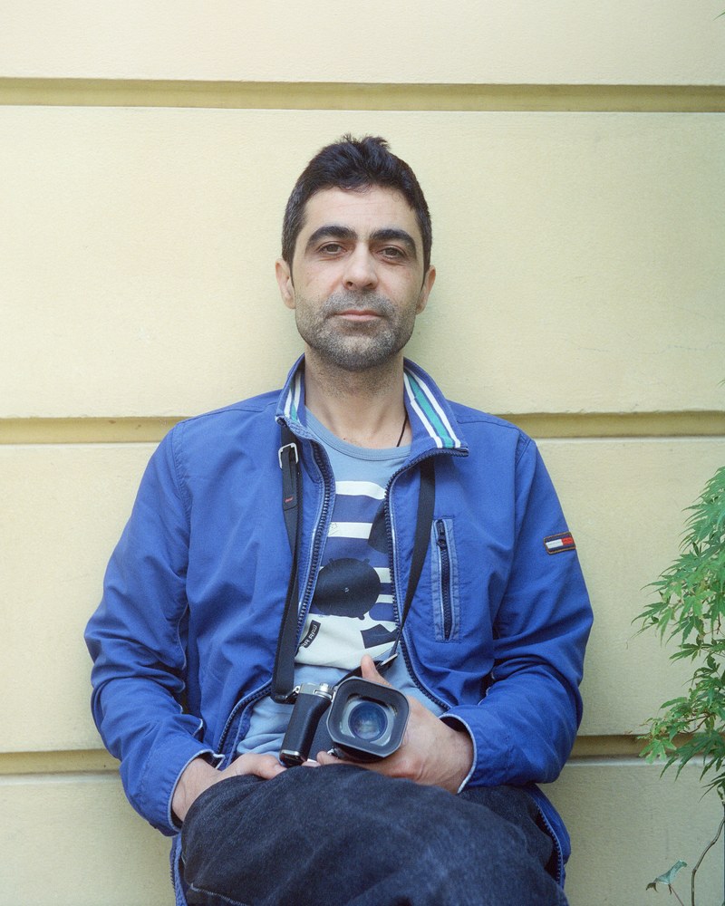Dovlet Annayev holding his camera